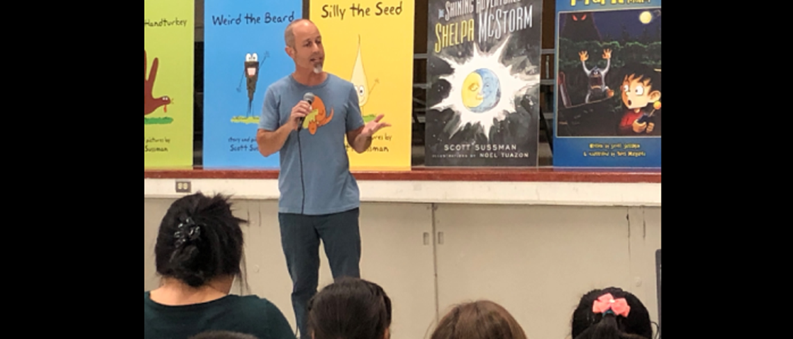Famous children's author, Scott Sussman, discussing the joys of writing in front of students.