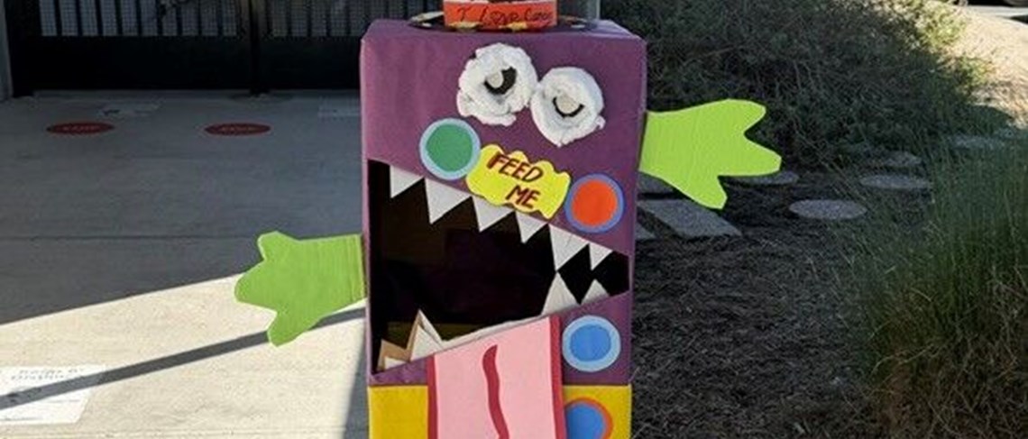 Candy monster container is collecting sweets for Trick or Trunk